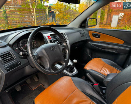 Черный Хендай Туксон, объемом двигателя 2 л и пробегом 210 тыс. км за 7990 $, фото 13 на Automoto.ua