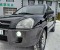 Черный Хендай Туксон, объемом двигателя 1.98 л и пробегом 258 тыс. км за 6900 $, фото 1 на Automoto.ua