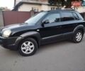 Чорний Хендай Туксон, об'ємом двигуна 1.99 л та пробігом 239 тис. км за 6990 $, фото 1 на Automoto.ua