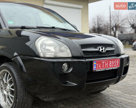 Черный Хендай Туксон, объемом двигателя 1.98 л и пробегом 231 тыс. км за 7750 $, фото 4 на Automoto.ua
