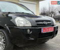Черный Хендай Туксон, объемом двигателя 1.98 л и пробегом 231 тыс. км за 7750 $, фото 4 на Automoto.ua