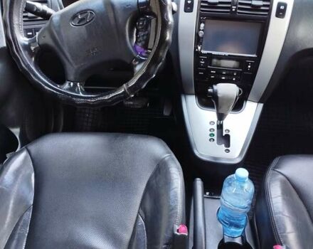 Черный Хендай Туксон, объемом двигателя 2.7 л и пробегом 290 тыс. км за 7300 $, фото 6 на Automoto.ua