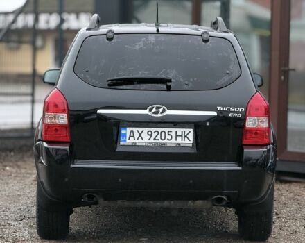 Черный Хендай Туксон, объемом двигателя 2 л и пробегом 263 тыс. км за 7950 $, фото 7 на Automoto.ua