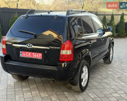 Черный Хендай Туксон, объемом двигателя 2 л и пробегом 249 тыс. км за 7450 $, фото 8 на Automoto.ua