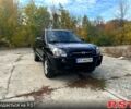 Черный Хендай Туксон, объемом двигателя 2 л и пробегом 250 тыс. км за 7500 $, фото 1 на Automoto.ua
