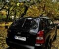 Черный Хендай Туксон, объемом двигателя 2 л и пробегом 240 тыс. км за 5600 $, фото 1 на Automoto.ua