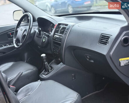 Черный Хендай Туксон, объемом двигателя 1.98 л и пробегом 231 тыс. км за 7750 $, фото 21 на Automoto.ua