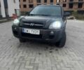 Черный Хендай Туксон, объемом двигателя 2 л и пробегом 369 тыс. км за 4300 $, фото 1 на Automoto.ua