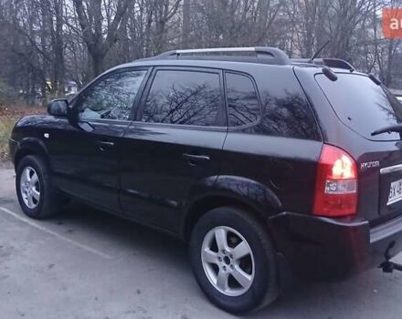 Черный Хендай Туксон, объемом двигателя 1.98 л и пробегом 320 тыс. км за 6300 $, фото 11 на Automoto.ua