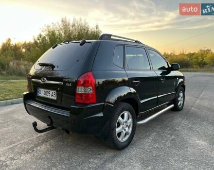 Черный Хендай Туксон, объемом двигателя 2 л и пробегом 235 тыс. км за 6700 $, фото 8 на Automoto.ua