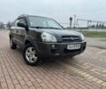 Черный Хендай Туксон, объемом двигателя 2 л и пробегом 220 тыс. км за 7200 $, фото 1 на Automoto.ua