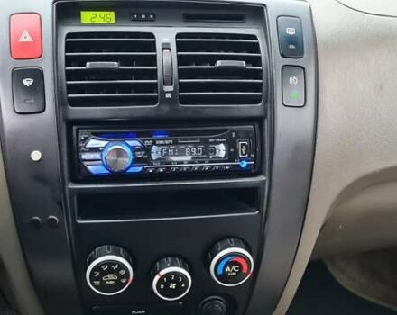 Черный Хендай Туксон, объемом двигателя 1.98 л и пробегом 277 тыс. км за 5350 $, фото 27 на Automoto.ua