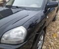 Черный Хендай Туксон, объемом двигателя 2 л и пробегом 230 тыс. км за 6800 $, фото 1 на Automoto.ua