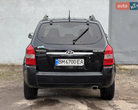 Черный Хендай Туксон, объемом двигателя 1.98 л и пробегом 198 тыс. км за 7500 $, фото 3 на Automoto.ua