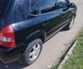 Черный Хендай Туксон, объемом двигателя 2 л и пробегом 295 тыс. км за 7700 $, фото 9 на Automoto.ua