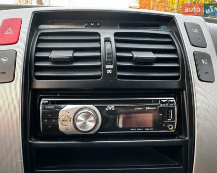 Черный Хендай Туксон, объемом двигателя 2 л и пробегом 210 тыс. км за 7990 $, фото 18 на Automoto.ua