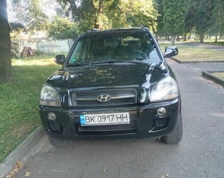 Черный Хендай Туксон, объемом двигателя 1.98 л и пробегом 225 тыс. км за 7500 $, фото 6 на Automoto.ua