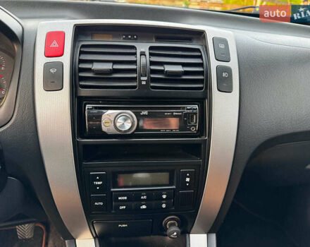 Черный Хендай Туксон, объемом двигателя 2 л и пробегом 210 тыс. км за 7990 $, фото 17 на Automoto.ua