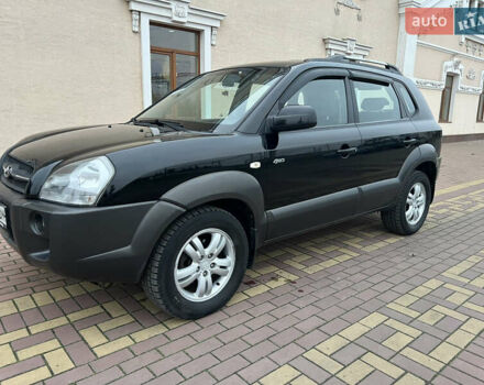 Черный Хендай Туксон, объемом двигателя 1.98 л и пробегом 227 тыс. км за 6900 $, фото 7 на Automoto.ua