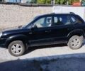 Черный Хендай Туксон, объемом двигателя 1.98 л и пробегом 190 тыс. км за 7800 $, фото 6 на Automoto.ua