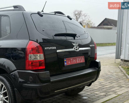 Черный Хендай Туксон, объемом двигателя 1.98 л и пробегом 231 тыс. км за 7750 $, фото 7 на Automoto.ua