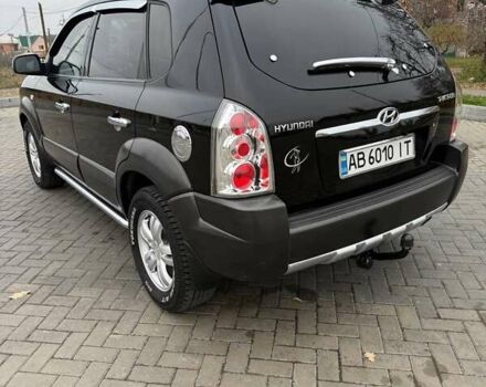 Чорний Хендай Туксон, об'ємом двигуна 2 л та пробігом 124 тис. км за 7950 $, фото 4 на Automoto.ua