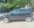 Черный Хендай Туксон, объемом двигателя 2 л и пробегом 248 тыс. км за 8200 $, фото 1 на Automoto.ua