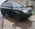 Черный Хендай Туксон, объемом двигателя 2 л и пробегом 395 тыс. км за 4500 $, фото 1 на Automoto.ua