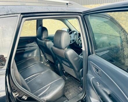 Черный Хендай Туксон, объемом двигателя 2 л и пробегом 310 тыс. км за 6600 $, фото 6 на Automoto.ua