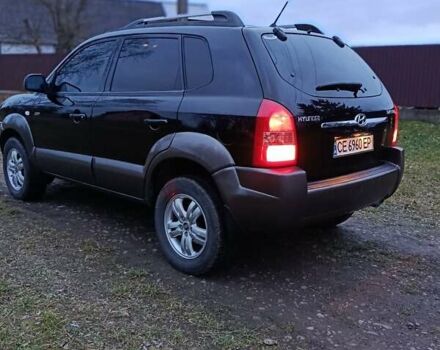 Черный Хендай Туксон, объемом двигателя 1.98 л и пробегом 253 тыс. км за 7600 $, фото 5 на Automoto.ua