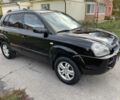 Черный Хендай Туксон, объемом двигателя 2 л и пробегом 163 тыс. км за 7700 $, фото 2 на Automoto.ua