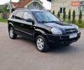 Черный Хендай Туксон, объемом двигателя 2 л и пробегом 215 тыс. км за 8850 $, фото 1 на Automoto.ua