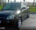 Черный Хендай Туксон, объемом двигателя 2 л и пробегом 260 тыс. км за 8000 $, фото 1 на Automoto.ua