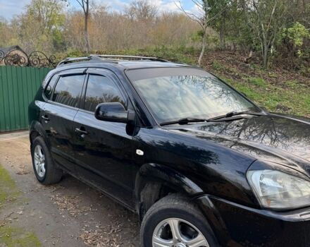 Черный Хендай Туксон, объемом двигателя 2 л и пробегом 210 тыс. км за 7200 $, фото 3 на Automoto.ua