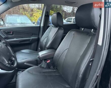 Чорний Хендай Туксон, об'ємом двигуна 2 л та пробігом 167 тис. км за 7950 $, фото 12 на Automoto.ua