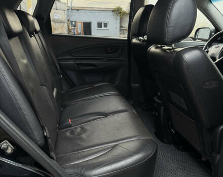 Черный Хендай Туксон, объемом двигателя 1.98 л и пробегом 198 тыс. км за 7500 $, фото 13 на Automoto.ua