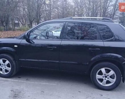 Черный Хендай Туксон, объемом двигателя 1.98 л и пробегом 320 тыс. км за 6300 $, фото 4 на Automoto.ua