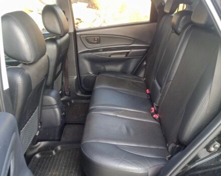 Черный Хендай Туксон, объемом двигателя 2 л и пробегом 203 тыс. км за 7500 $, фото 6 на Automoto.ua