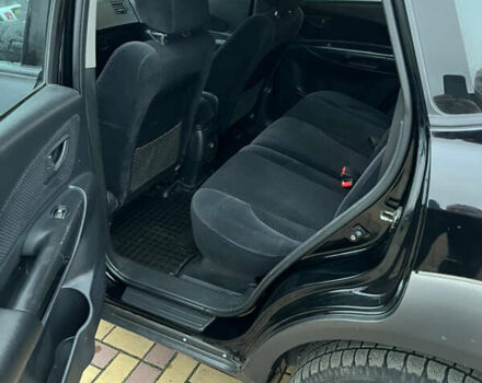 Черный Хендай Туксон, объемом двигателя 1.98 л и пробегом 227 тыс. км за 6900 $, фото 27 на Automoto.ua