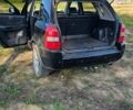 Черный Хендай Туксон, объемом двигателя 1.98 л и пробегом 275 тыс. км за 6600 $, фото 4 на Automoto.ua