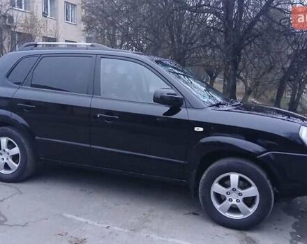 Черный Хендай Туксон, объемом двигателя 1.98 л и пробегом 320 тыс. км за 6300 $, фото 2 на Automoto.ua