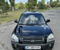 Черный Хендай Туксон, объемом двигателя 2 л и пробегом 249 тыс. км за 5800 $, фото 2 на Automoto.ua