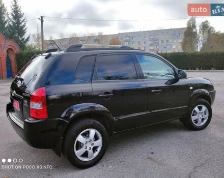 Черный Хендай Туксон, объемом двигателя 2 л и пробегом 237 тыс. км за 7999 $, фото 7 на Automoto.ua