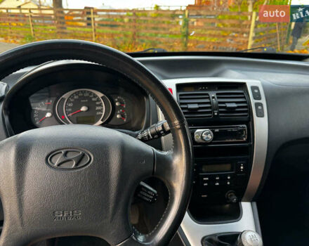 Черный Хендай Туксон, объемом двигателя 2 л и пробегом 210 тыс. км за 7990 $, фото 21 на Automoto.ua