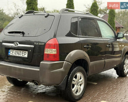 Черный Хендай Туксон, объемом двигателя 2 л и пробегом 256 тыс. км за 7450 $, фото 6 на Automoto.ua
