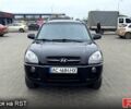 Черный Хендай Туксон, объемом двигателя 2 л и пробегом 200 тыс. км за 7800 $, фото 1 на Automoto.ua
