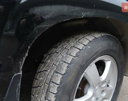 Чорний Хендай Туксон, об'ємом двигуна 1.98 л та пробігом 320 тис. км за 6500 $, фото 9 на Automoto.ua