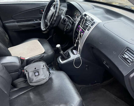 Черный Хендай Туксон, объемом двигателя 2 л и пробегом 242 тыс. км за 6999 $, фото 21 на Automoto.ua