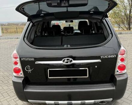 Чорний Хендай Туксон, об'ємом двигуна 2 л та пробігом 124 тис. км за 7950 $, фото 11 на Automoto.ua