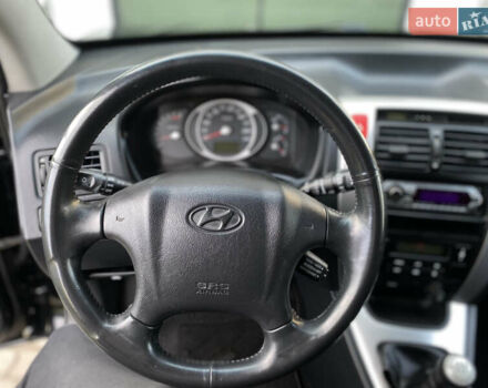 Чорний Хендай Туксон, об'ємом двигуна 1.98 л та пробігом 233 тис. км за 7650 $, фото 53 на Automoto.ua